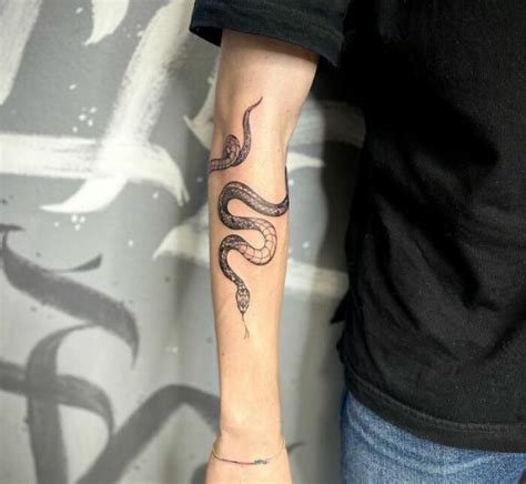 gucci snake tatto|snake wrapping around forearm tattoo.